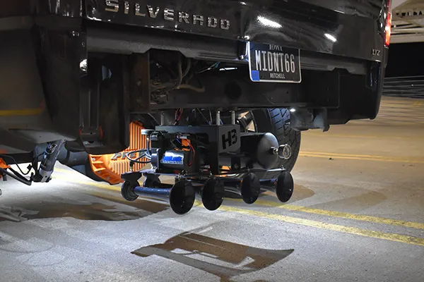 Rear undercarriage view of Lucas's 2008 Chevy Silverado 2500HD showing Shocker XL train horn assembly and air tank mounted under the bed, install photo 2