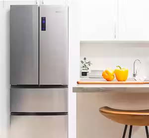 Haier french door refrigerator installed in small contemporary kitchen.