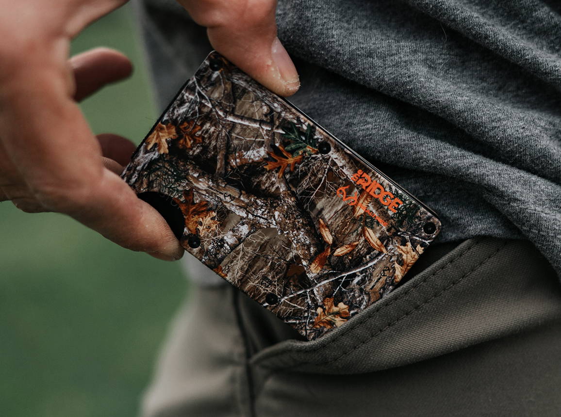 Realtree EDGE wallet pulled out from pocket