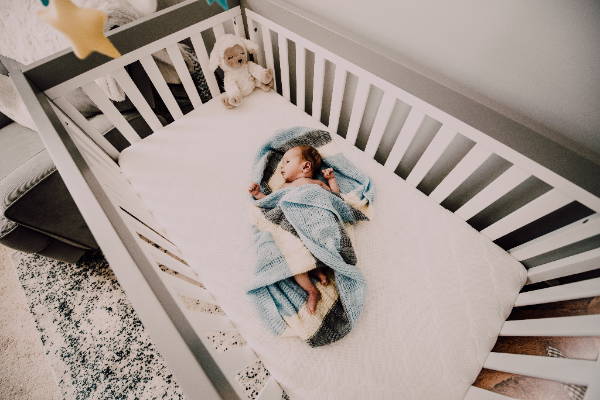 small baby left alone in crib