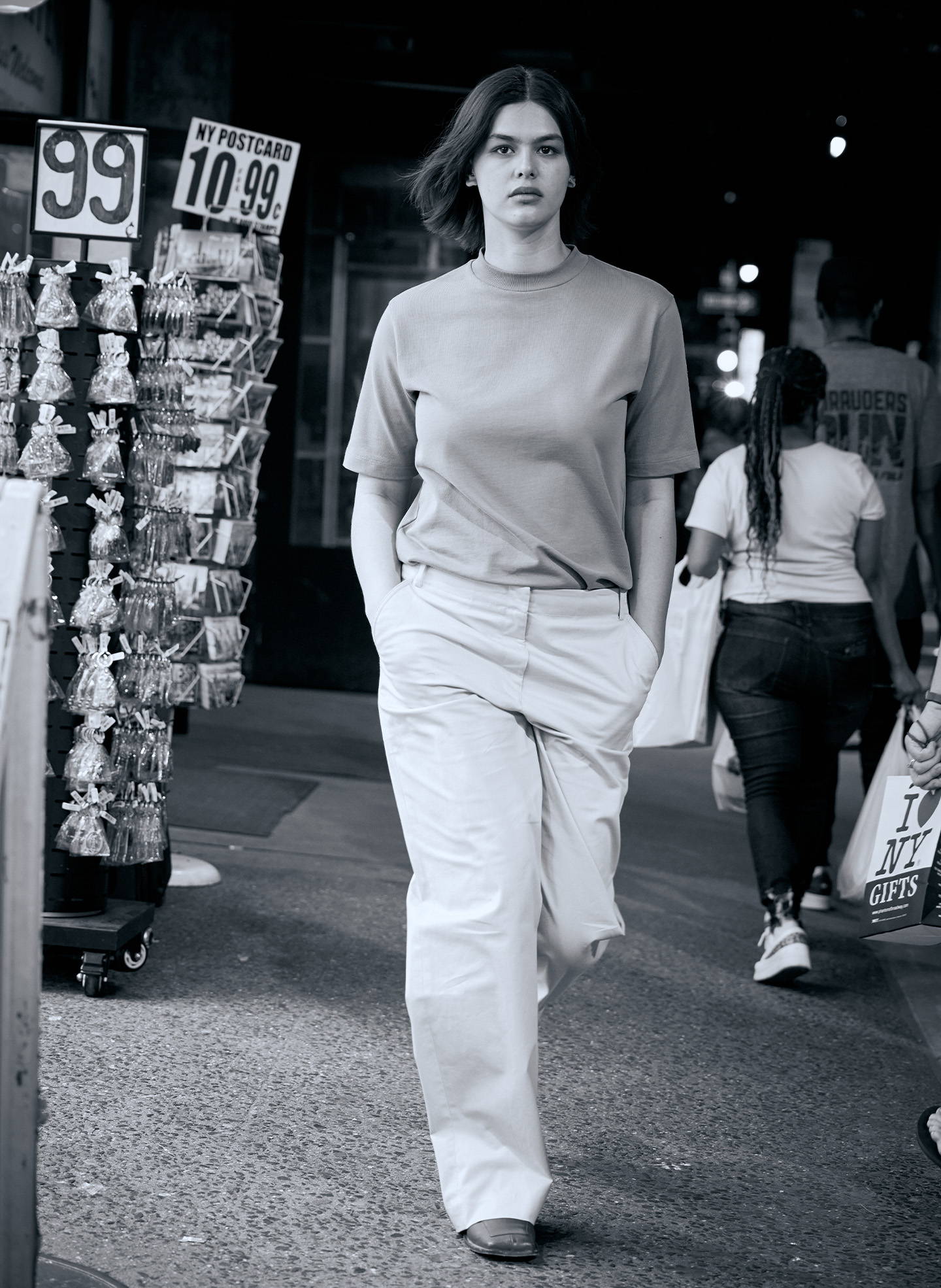 model walking in front of souvenir shop
