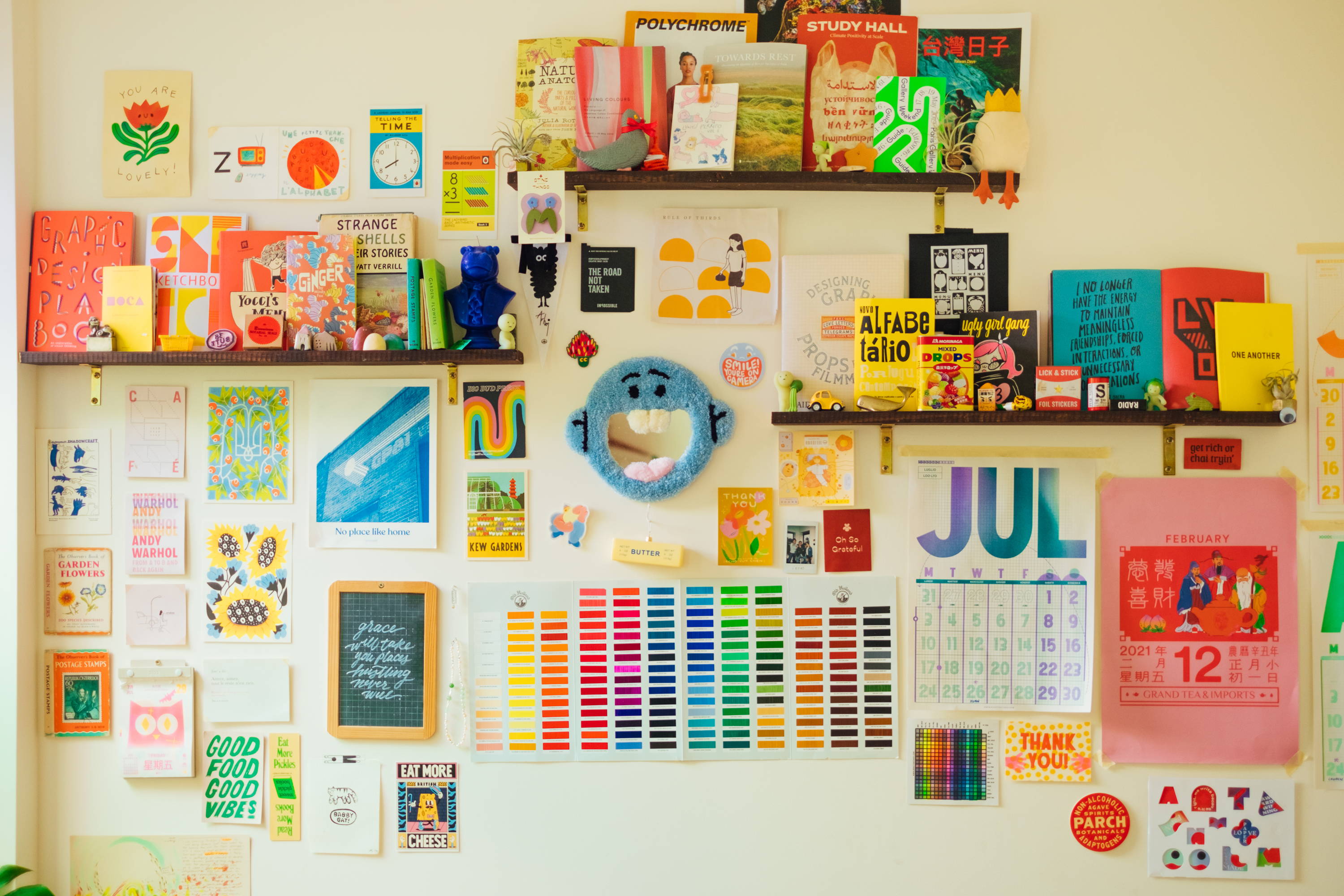 Colorfully decorated wall, featuring a calendar and color coded tabs
