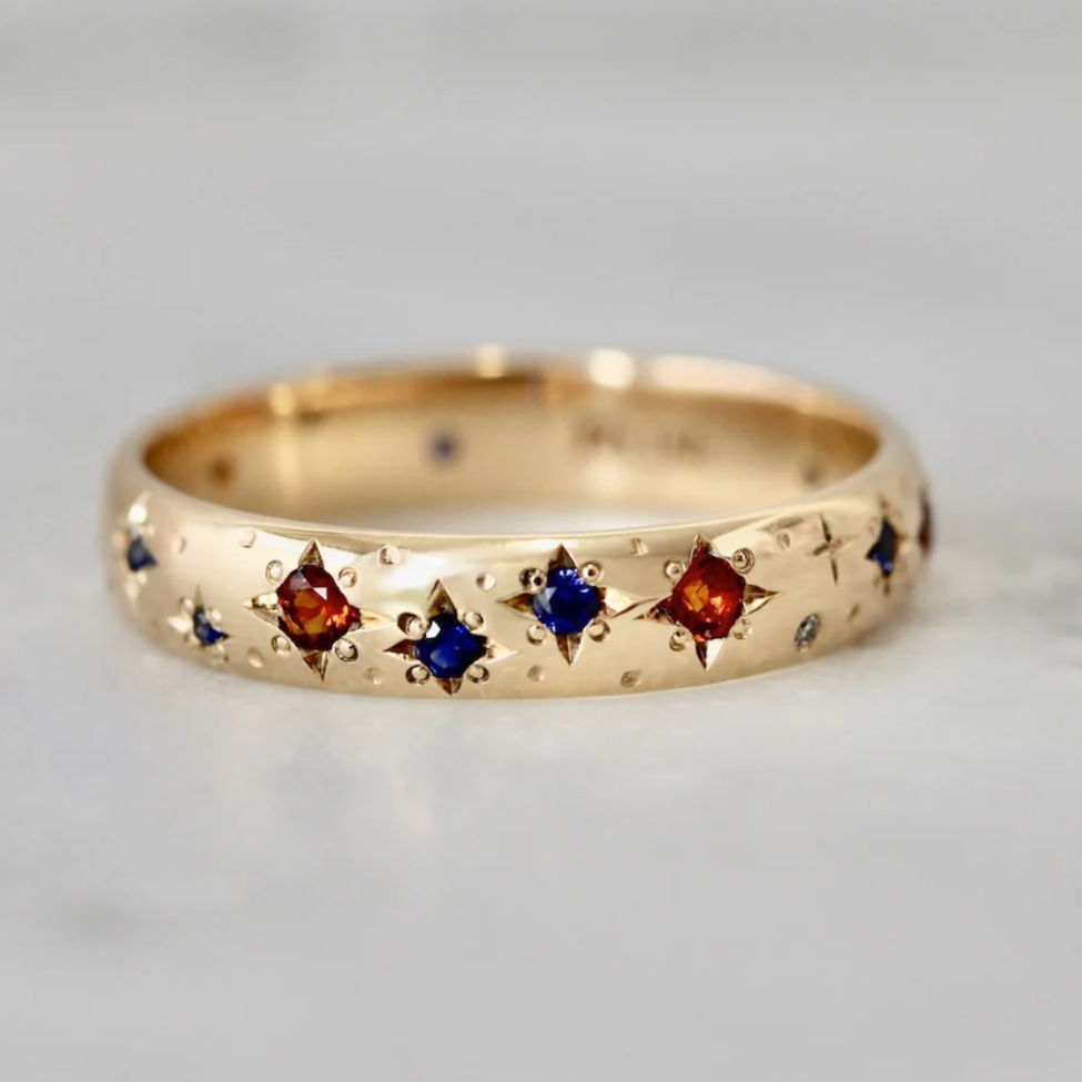 Hand-engraved wedding ring with star set sapphires