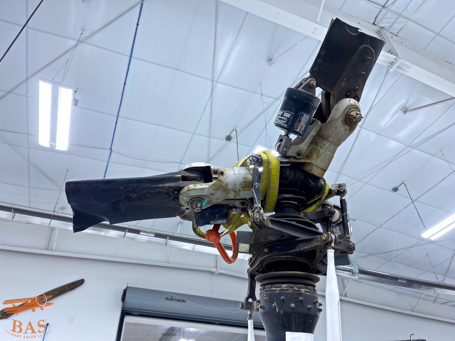 Drone propeller and motor assembly in a hangar setting.