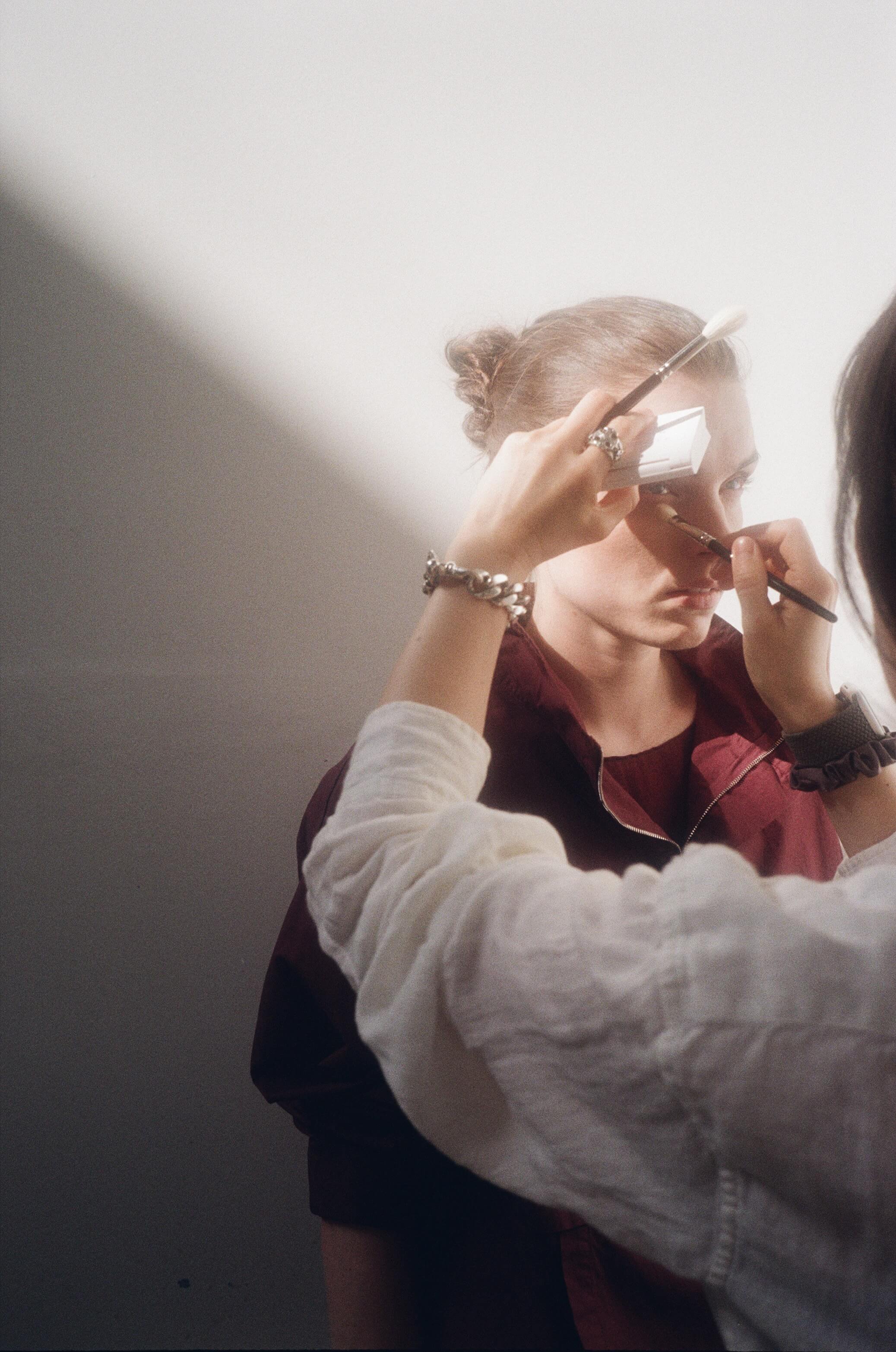 Woman having her make up done