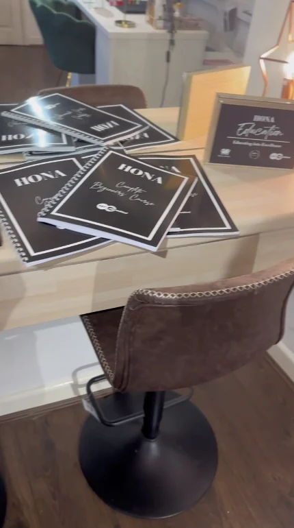 A table with menus and a brown chair.