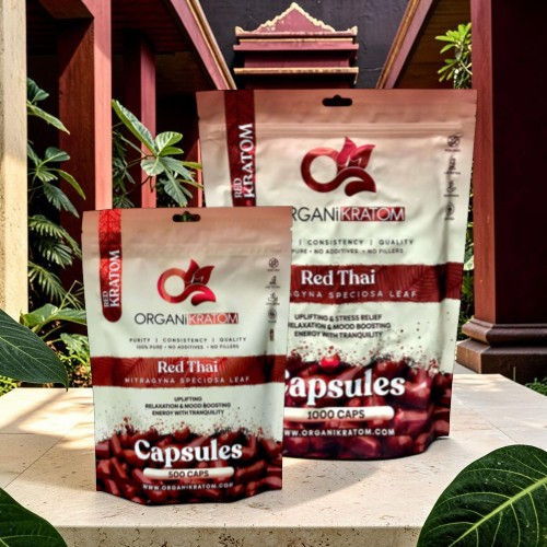 Packaging of Red Thai capsules on a decorative background.
