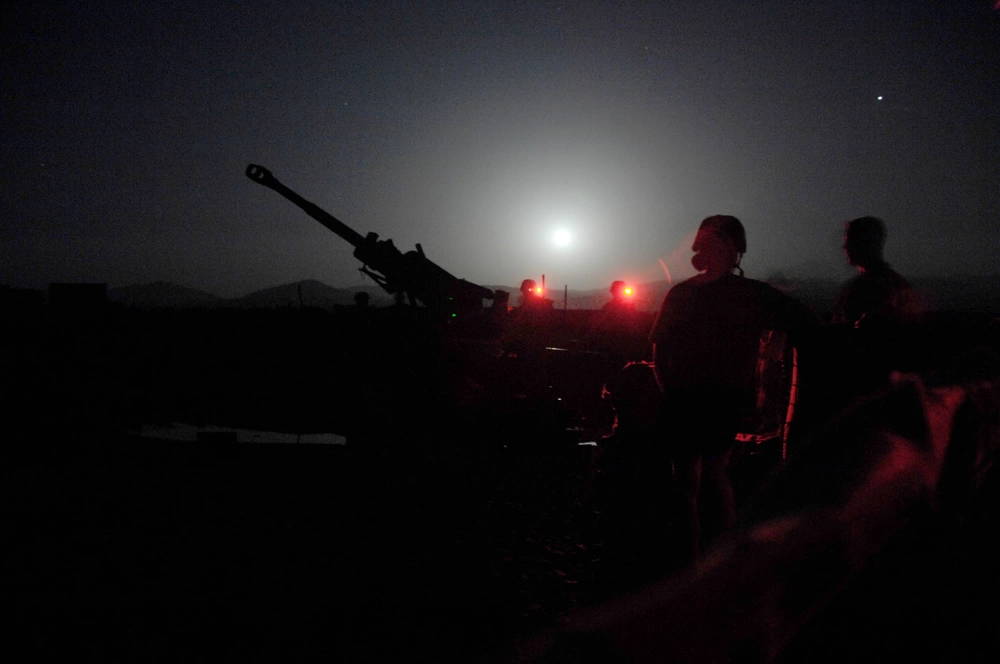 U.S. Army Soldiers of Alpha Battery, 2nd Battalion, 377th Parachute Field Artillery Regiment, 4th Brigade Combat Team, 25th Infantry Division, prepare for a fire mission in order to register their new M198 155 mm howitzer at Forward Operating Base Boris, East Paktia, Afghanistan, August 8, 2009.