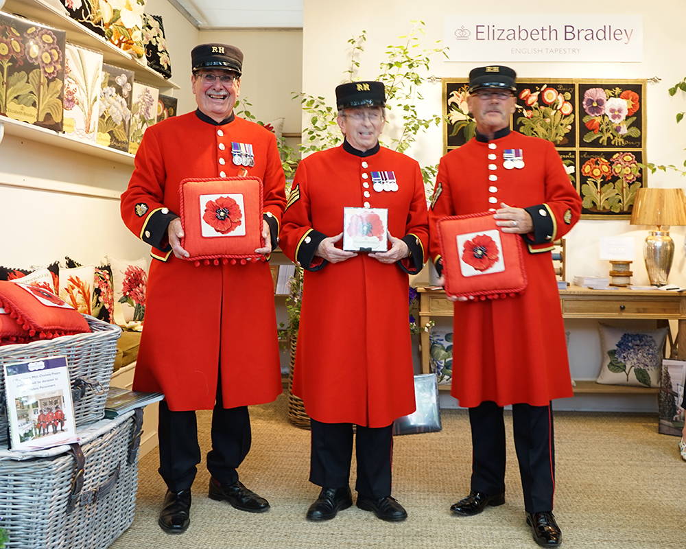 Chelsea Pensioners holding the Chelsea Poppy cushions & kit