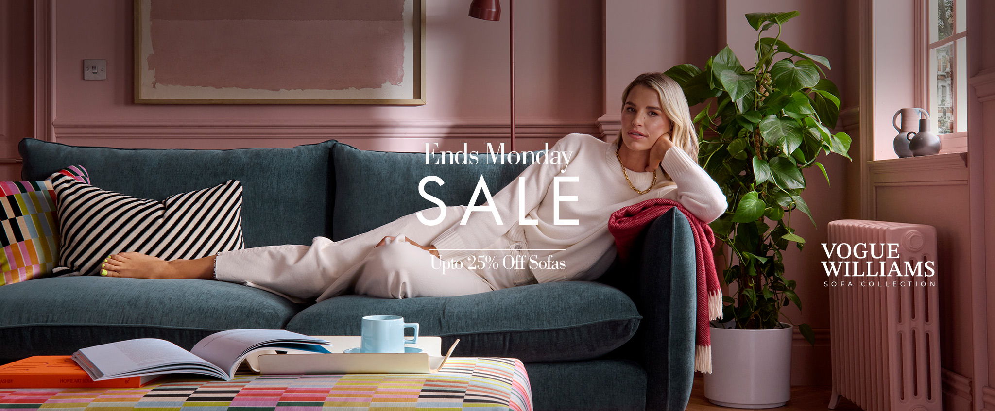 Woman lounging on a couch with a sale announcement in a cozy room.
