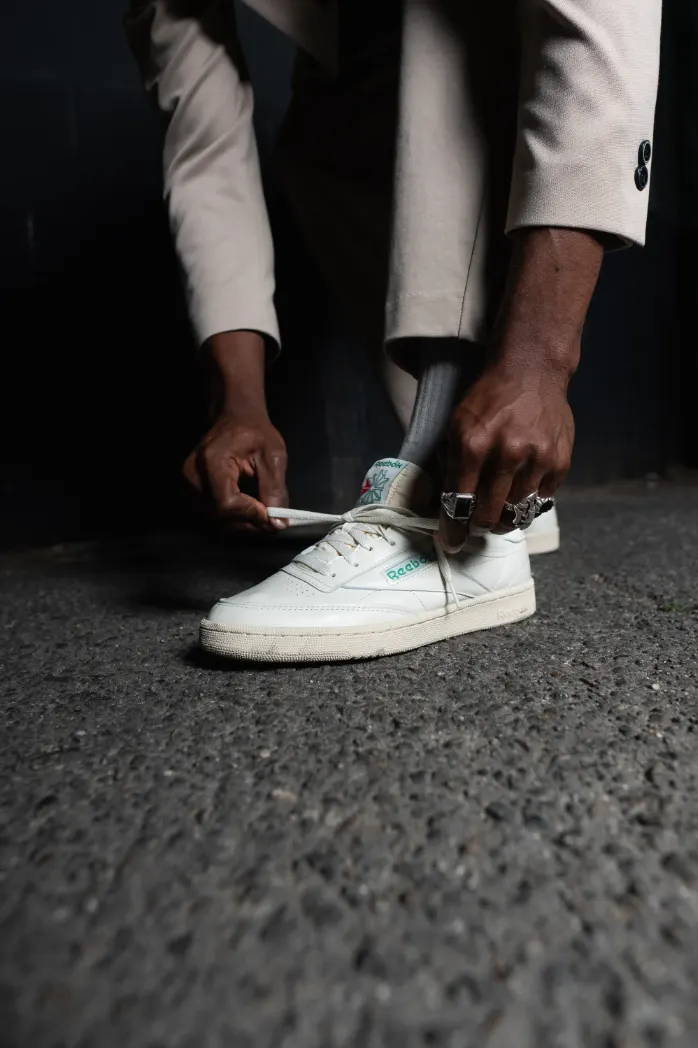 male model tying his reeboks