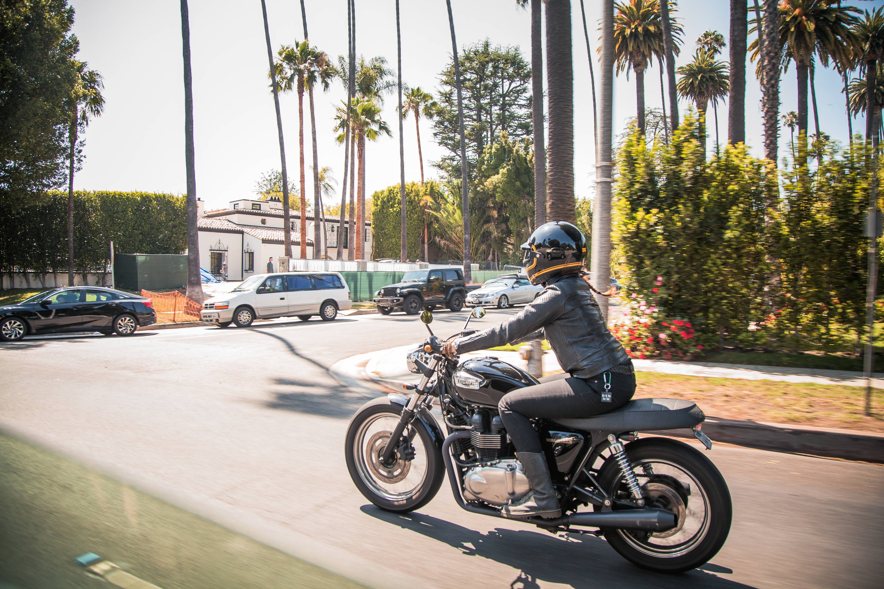 Sam cruising town on her Triumph Bonneville with bits from British Customs