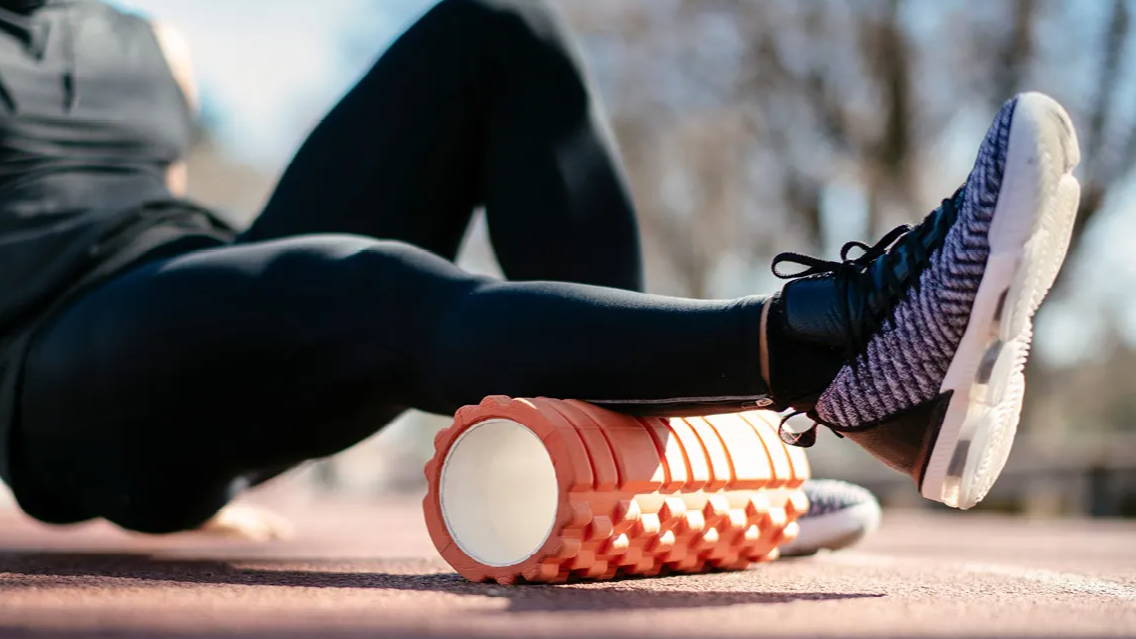 Man foam-rolling to stretch