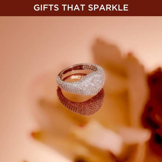 Click to shop gifts that sparkle. Image of silver ring.