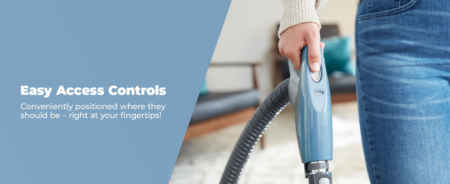 Person holding a vacuum cleaner handle with easy access controls.