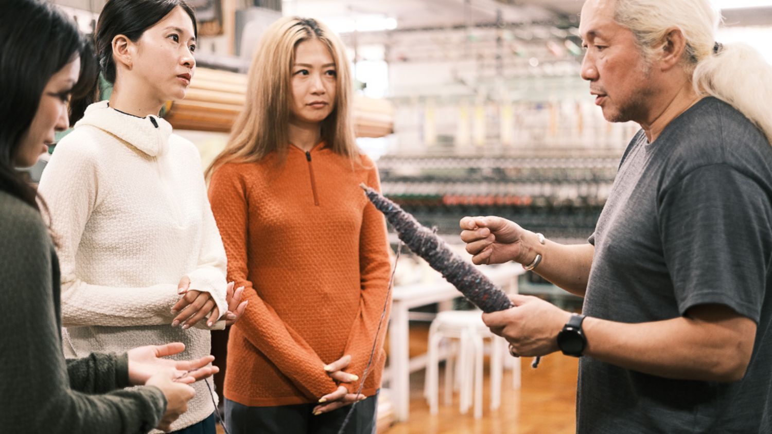 A group of four people engaged in a discussion.