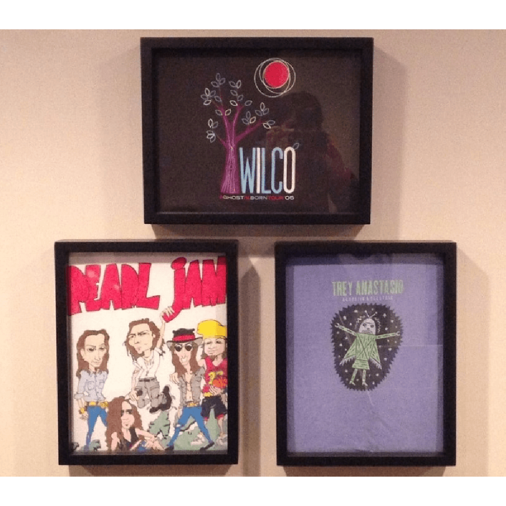 Wilco, Pearl Jam and Trey Anastasio concert tee shirts displayed in three Shart Original T-Shirt Frames
