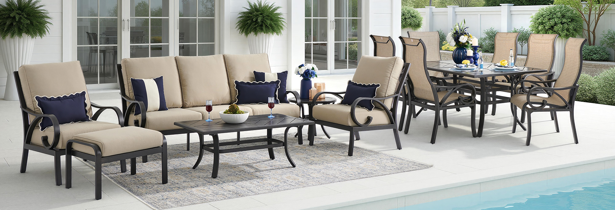 Outdoor patio furniture set arranged by a poolside.