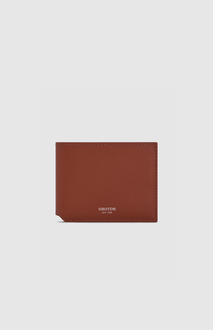 Brown leather wallet on a light background.
