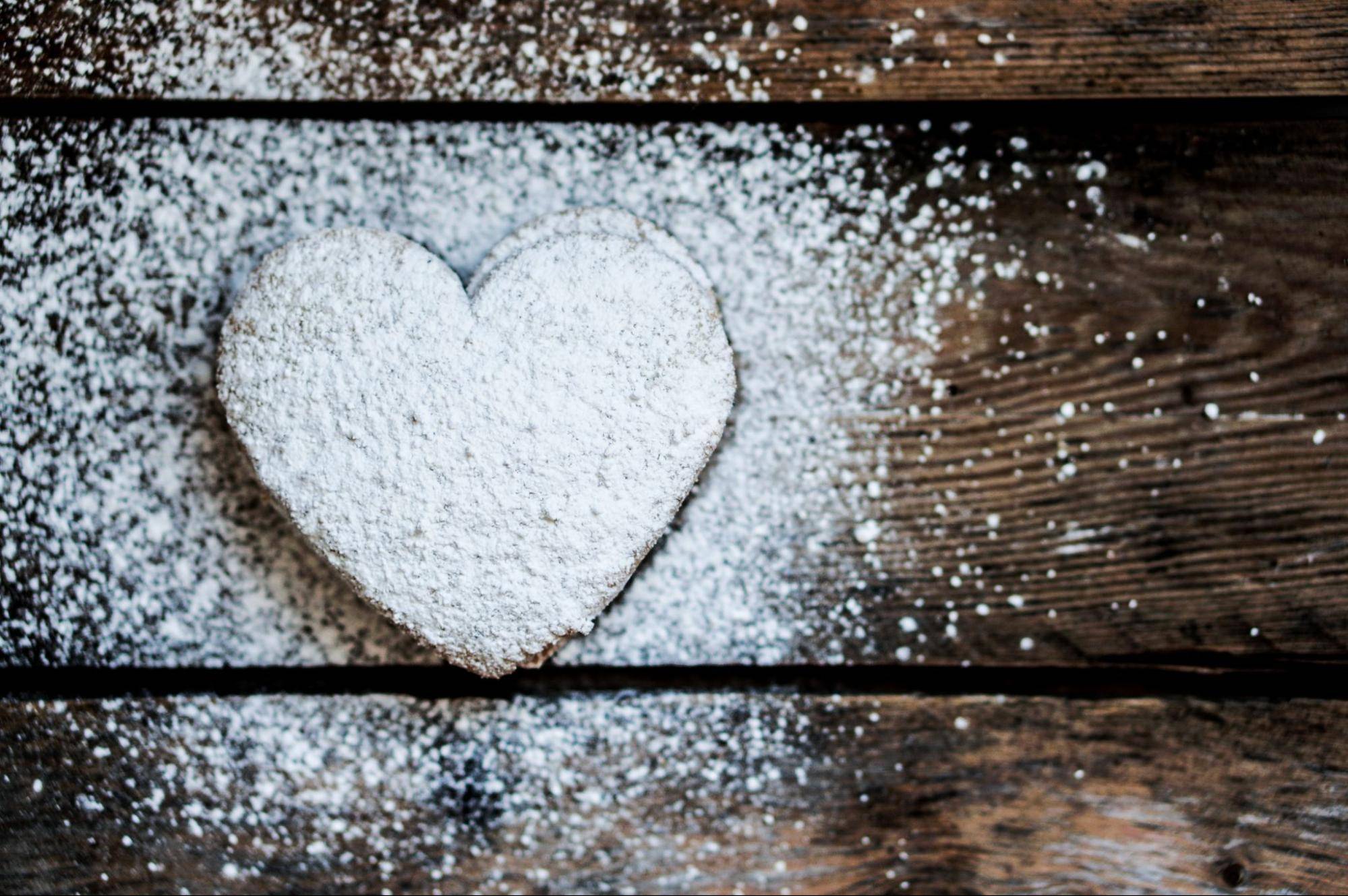 heart-shaped cookies with powdered sugar on top