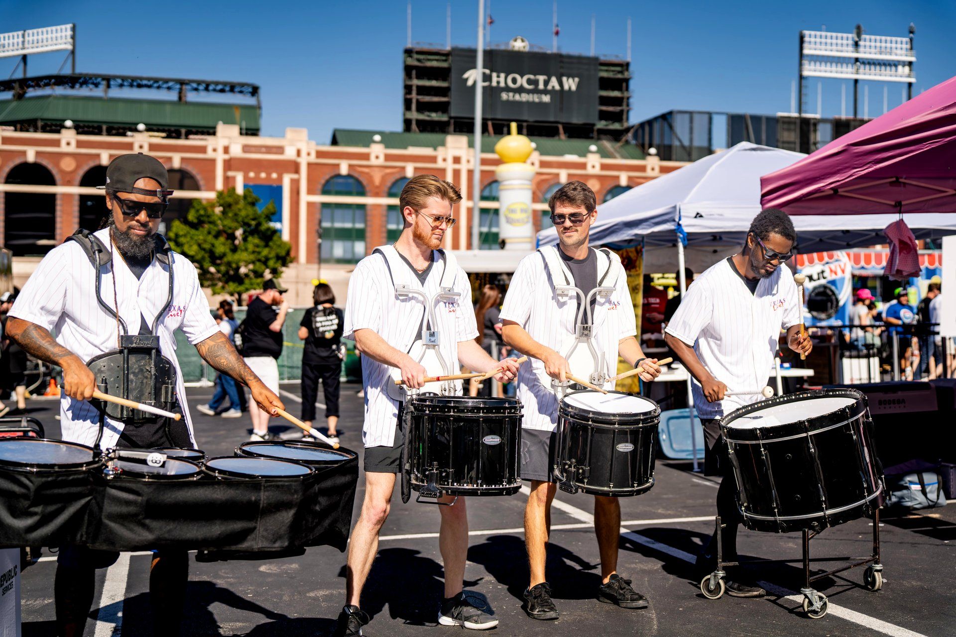 The Texas Live! drumline performs in front of Choctaw Stadium at The Big Dill pickle festival, Globe Life Field and Texas Live!, Arlington Texas 2025