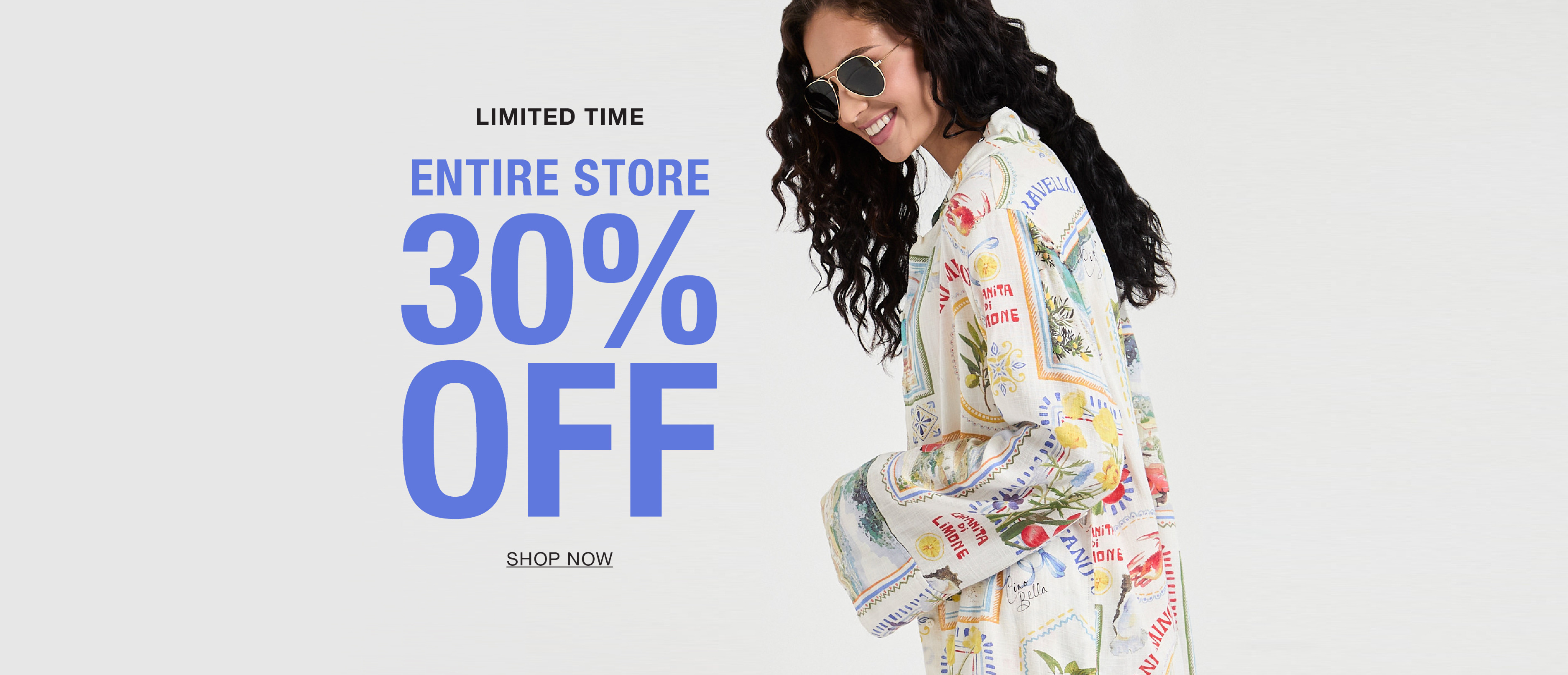 Woman in a colorful outfit promoting 30% off the entire store.