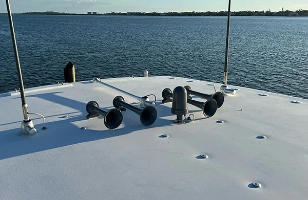 Side profile or deck-level view of Ryan's 44-foot Concept boat with Conductor's Special 544K Nightmare Edition train horn kit install context, HornBlasters gallery photo 2