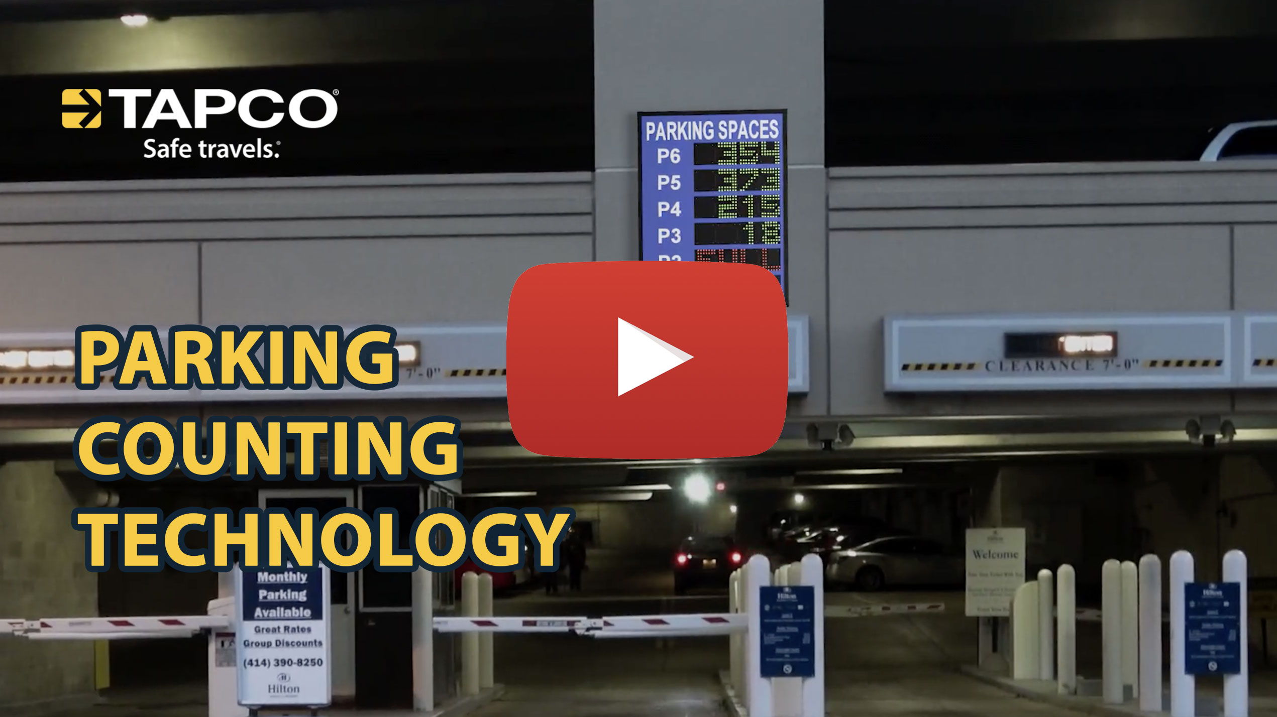 Parking counting technology display with video play button. TAPCO branding visible.