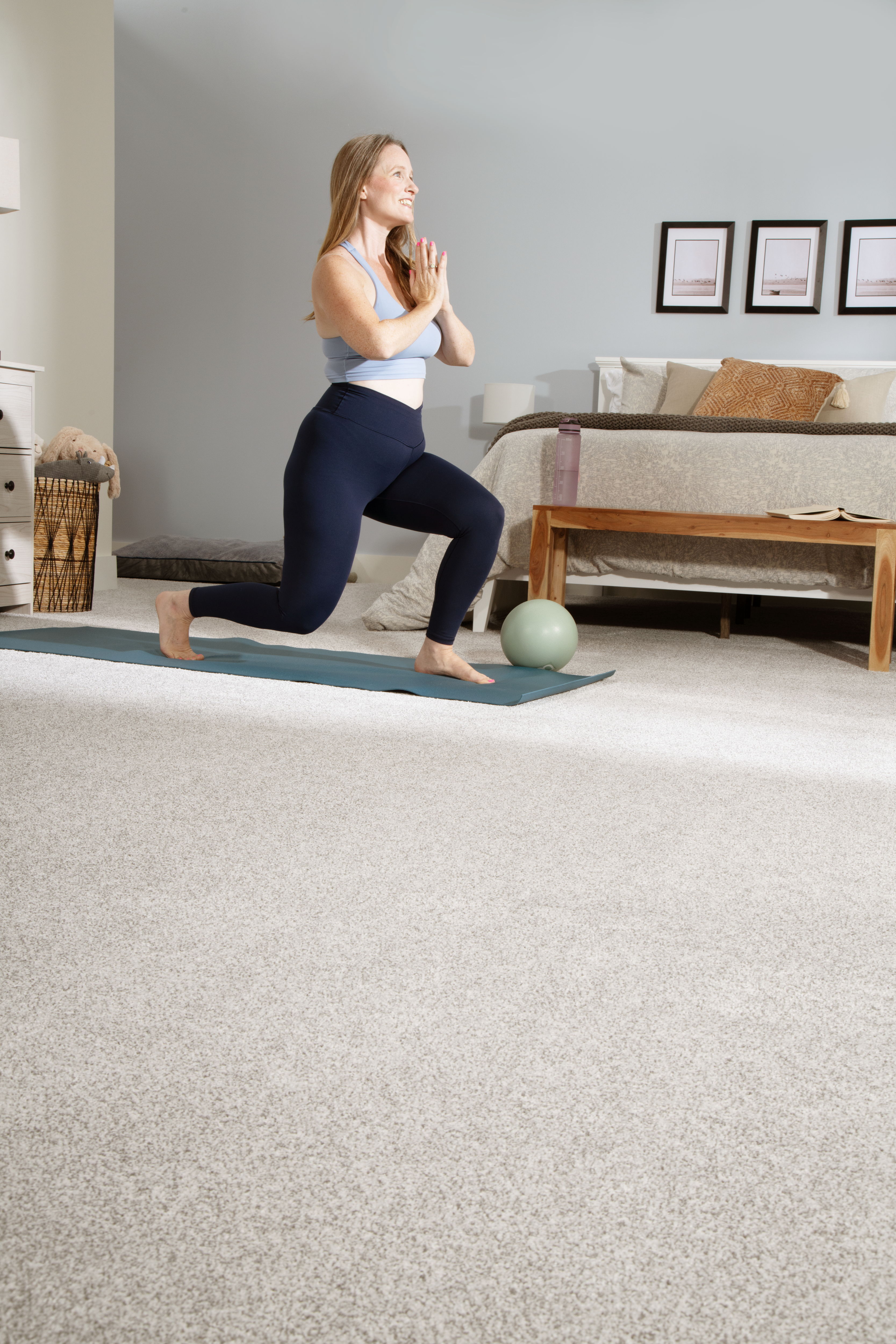 woman doing yoga in room with SmartStrand carpet