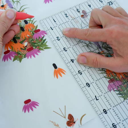 Marking fabric with a transparent quilt ruler 