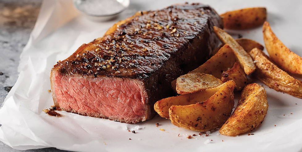 Thick New York Strip Steak and fries