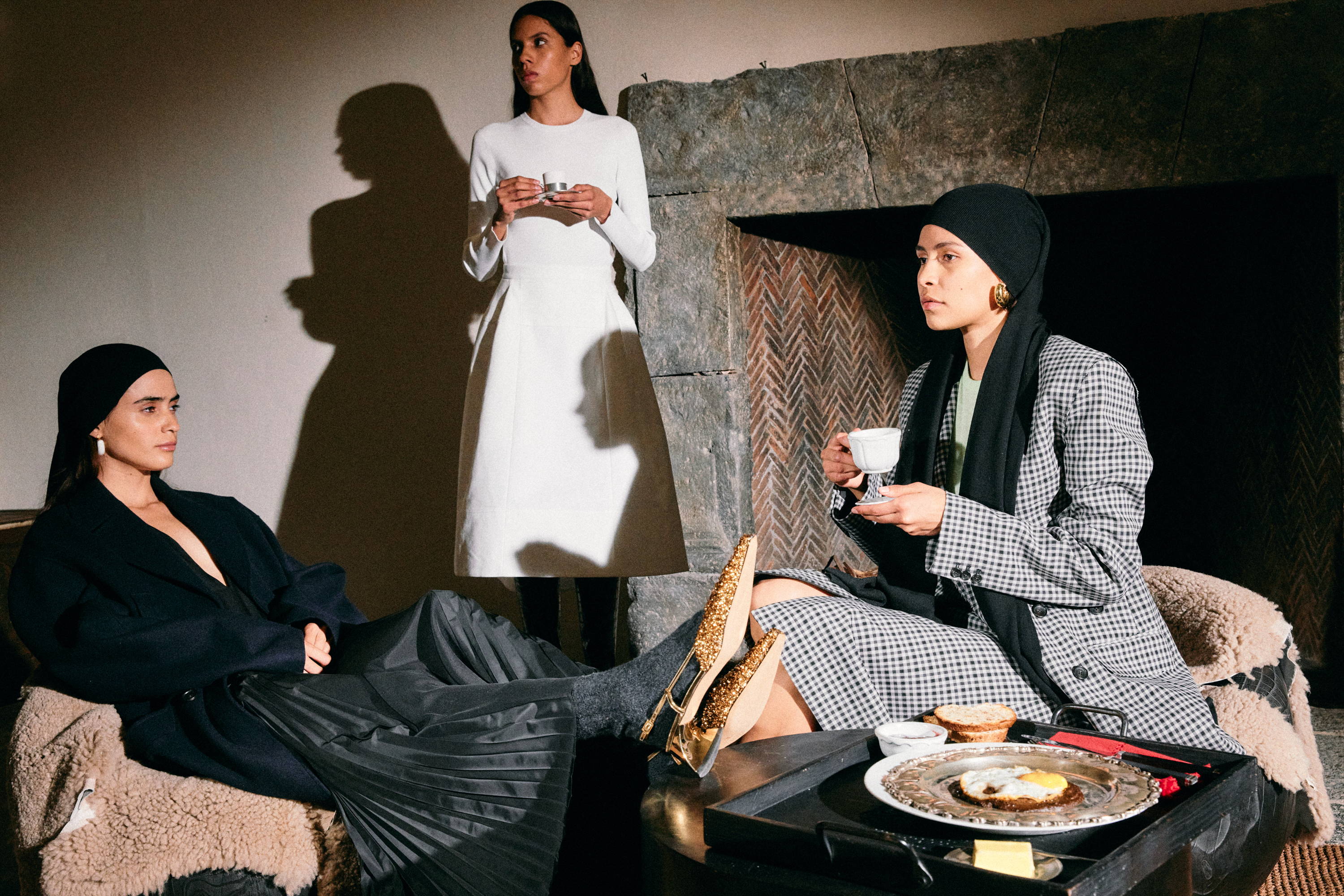 three women sitting drinking tea