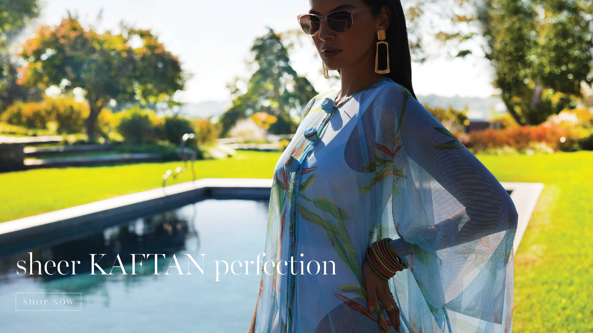 Sheer Kaftan Perfection | Woman wearing mesh bamboo printed blue green kaftan over a bathing suit by a pool by Ala von Auersperg for resort 2024