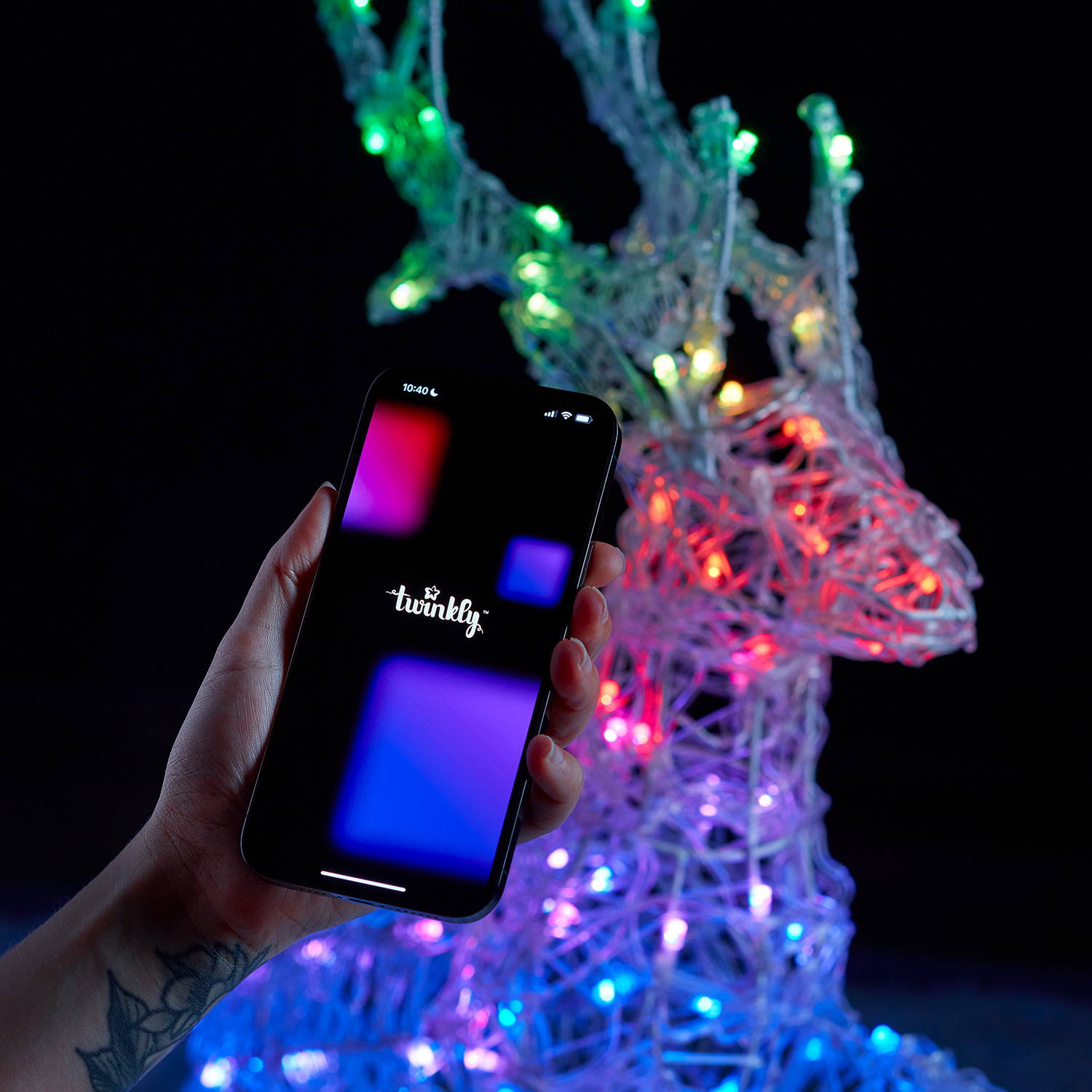 A person holding the Twinkly smart app in front of their reindeer.