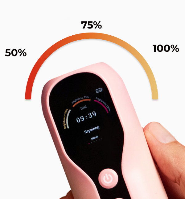 Smiling woman with a bun hairstyle against a pink background.