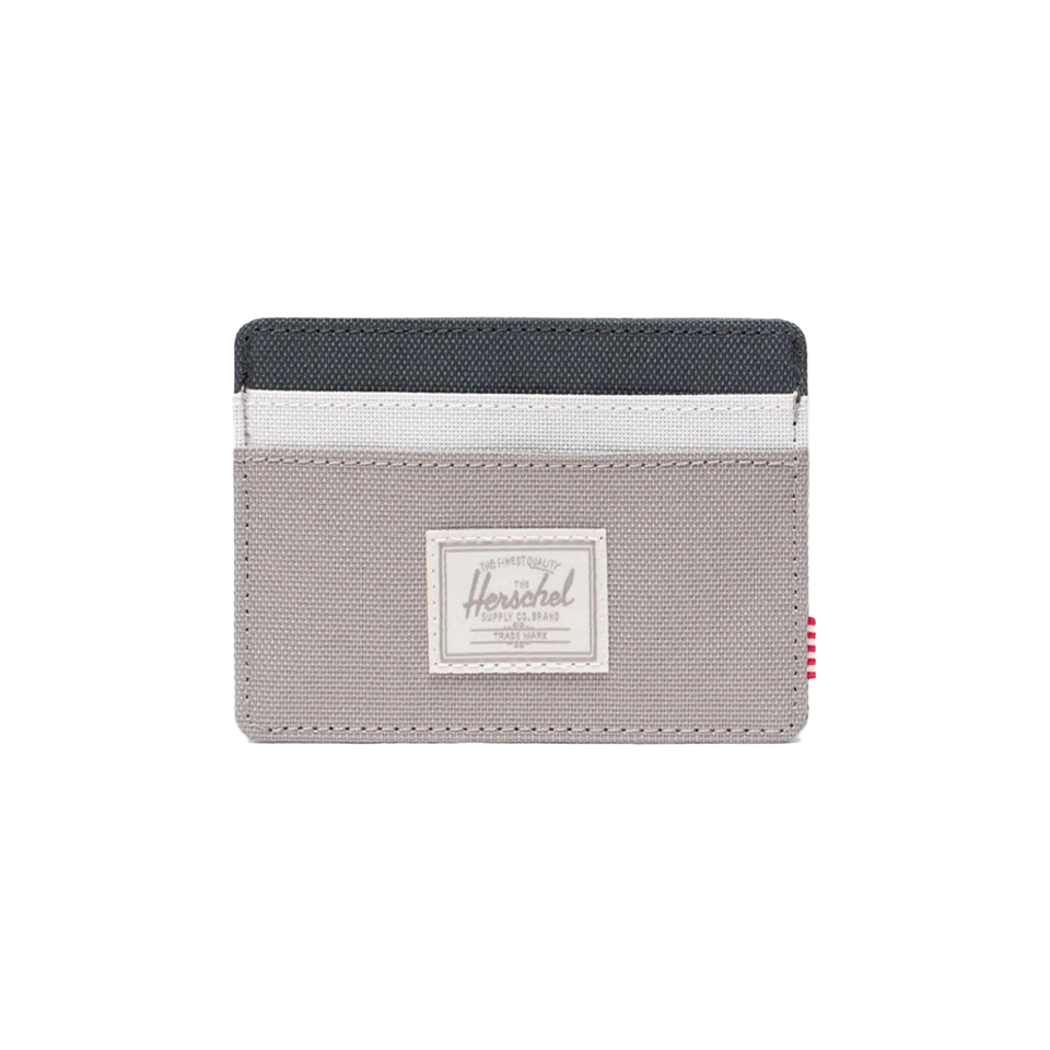 Gray card holder with black and white accents and a logo patch.