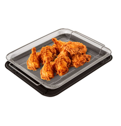 Fried chicken pieces on a glass tray with a black base.
