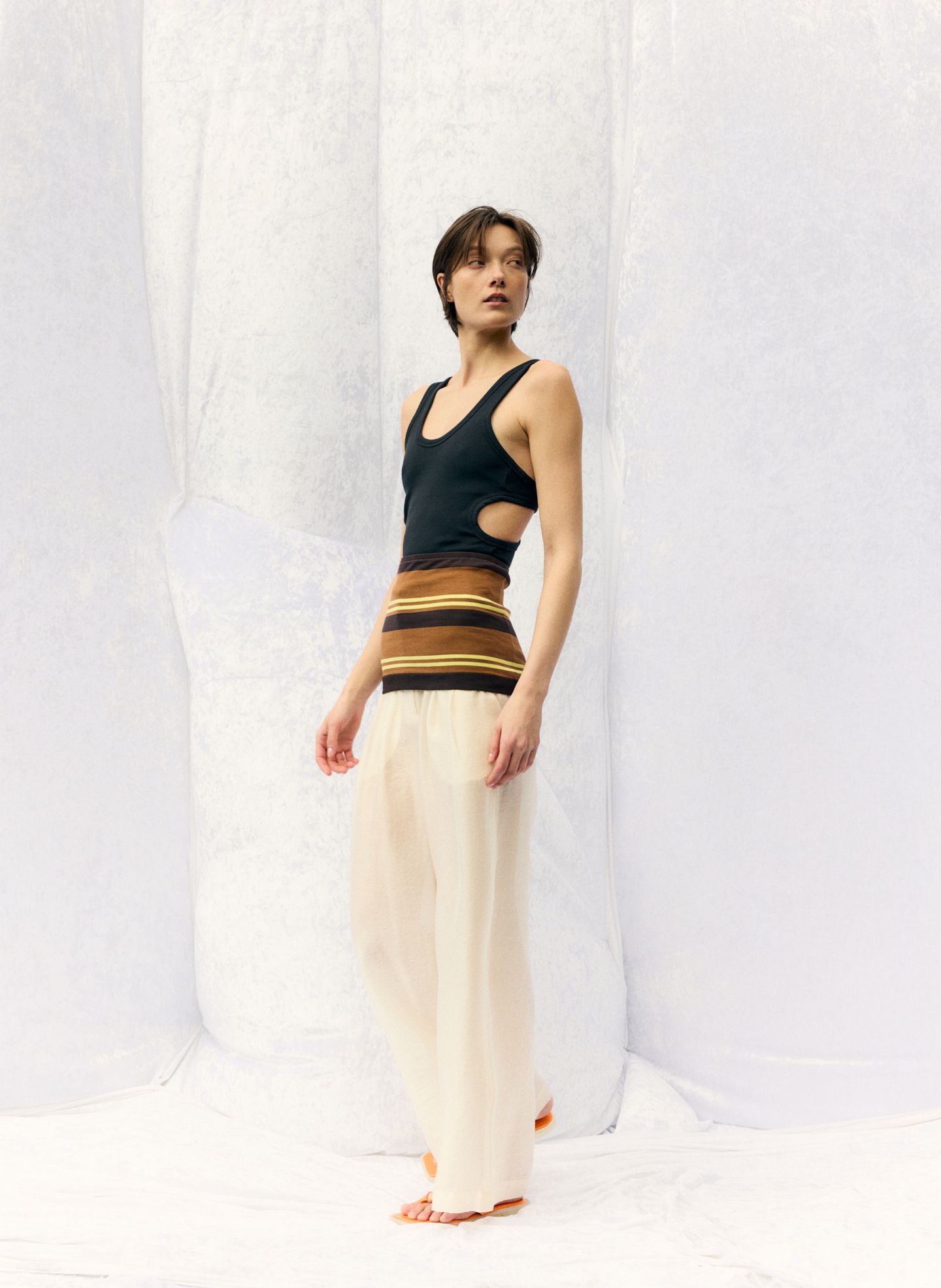 Model in stylish outfit against a plain background.