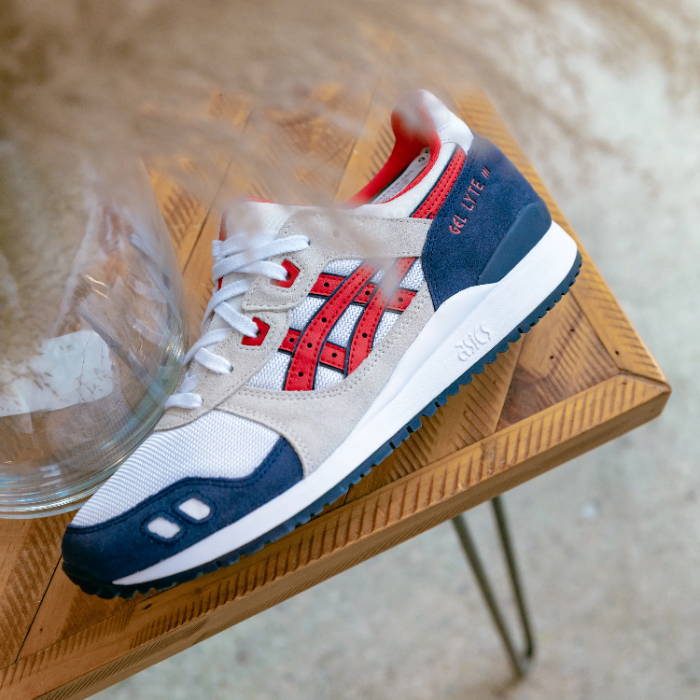 red white and blue asics shoe