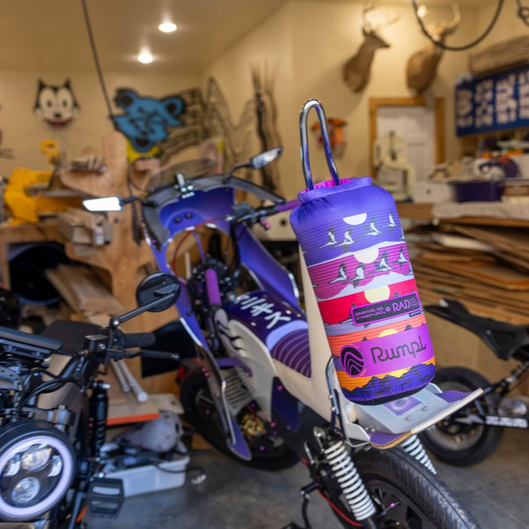 A Rumpl Blanket on a motorcycle inside a garage