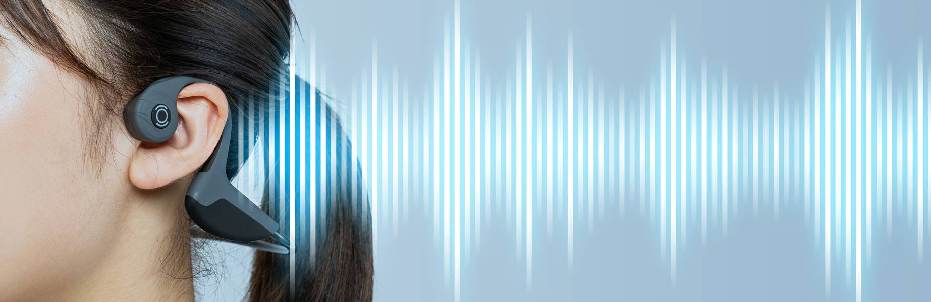 Close-up of woman wearing bone conduction headphone