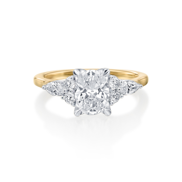 A gold engagement ring with a central diamond and side stones.