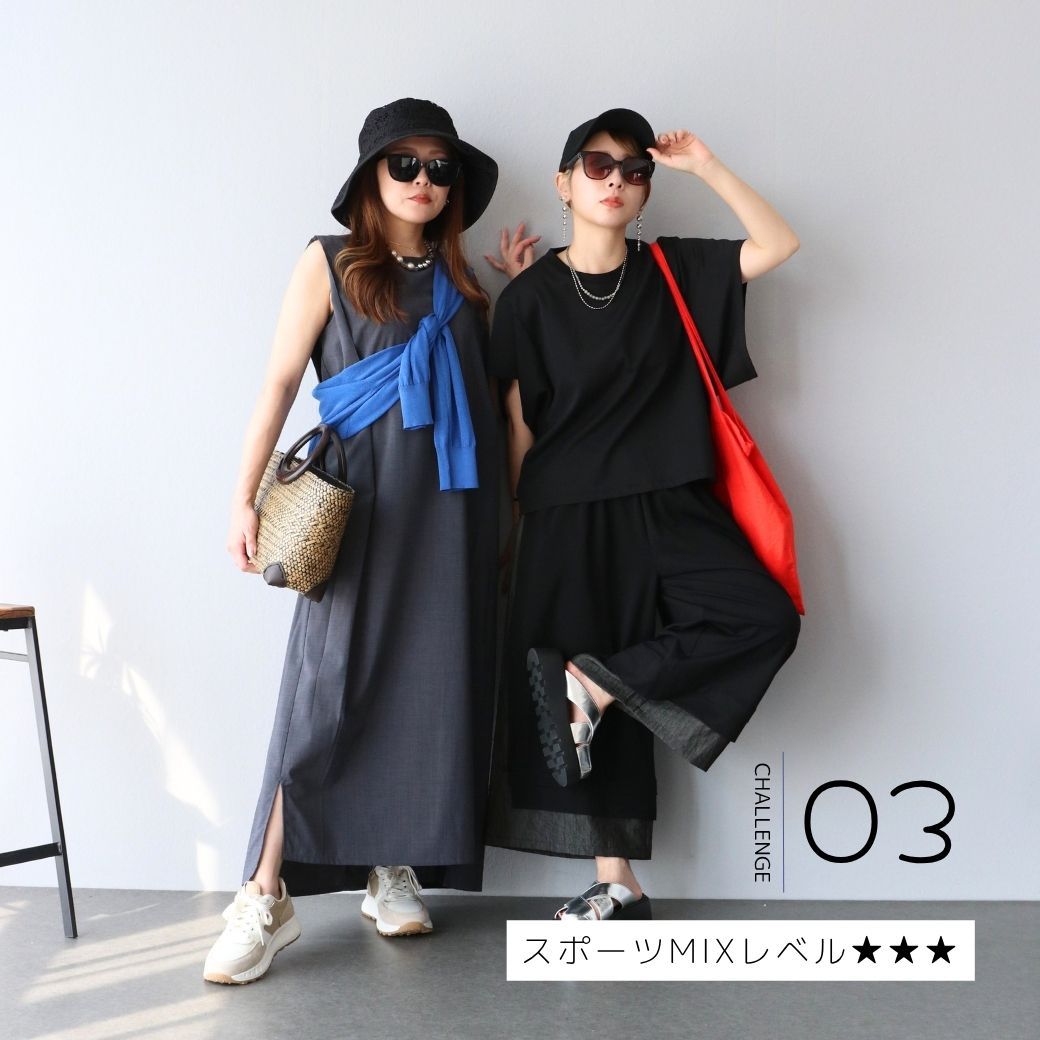 Two women in stylish outfits posing against a plain background.
