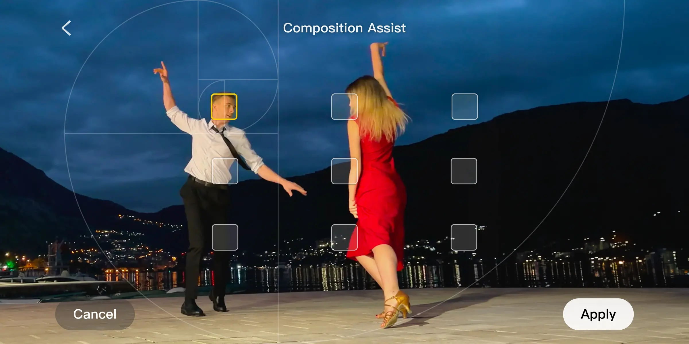 Two dancers in a scenic outdoor setting during twilight with a composition overlay.
