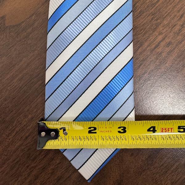 Standard tie with tape measure over widest point