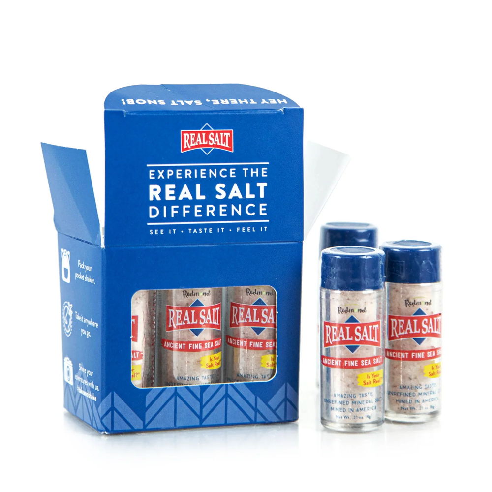 Packaging of Real Salt with three salt containers and a promotional box.