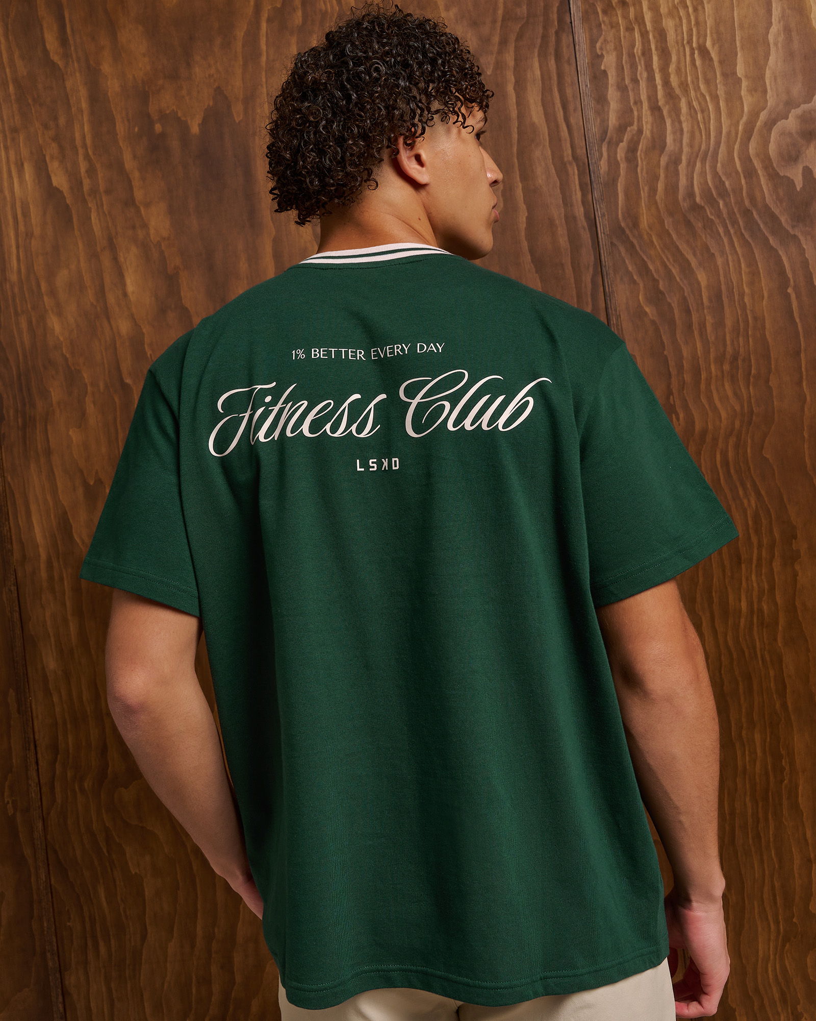 Person wearing a green t-shirt with 