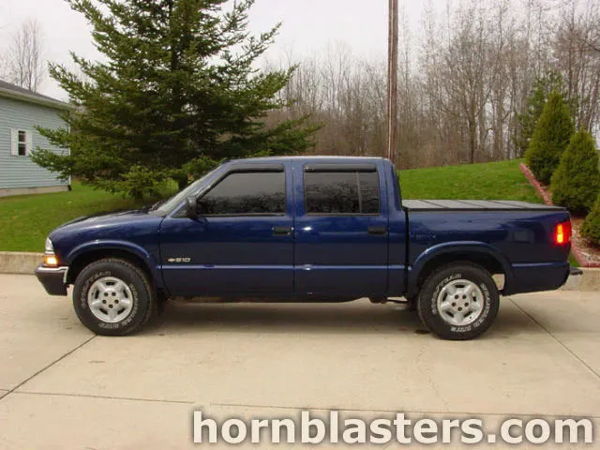 Side profile view of Kevin's blue 2002 Chevrolet S10 crew cab parked in the driveway, install photo 1
