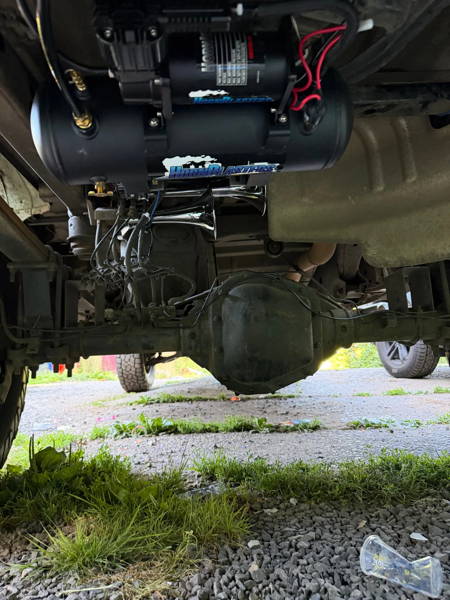 Outlaw train horns mounted behind the rear axle on a 2017 Ford F-150