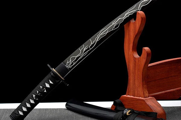 A decorative sword displayed on a wooden stand.